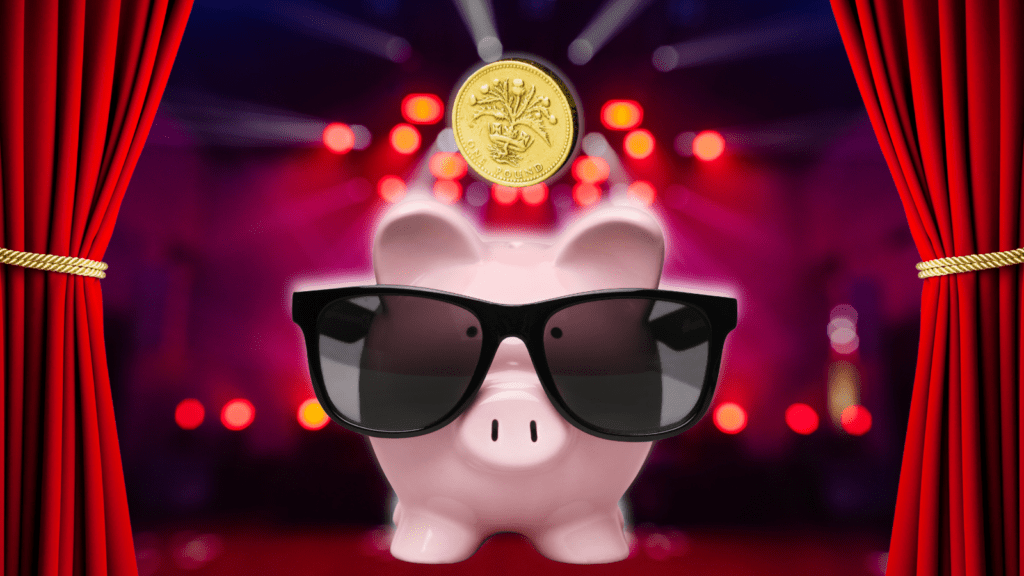 A piggy bank in dark glases with solitary coin dropping into it, on a brightly lit stage wth curtains being drawn.